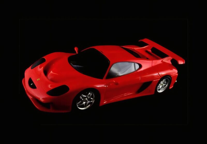 A red sports car with a rear spoiler, inspired by the 1-of-1: Rarest Ferraris In The World, is shown on a black background, viewed from an elevated front-side angle.