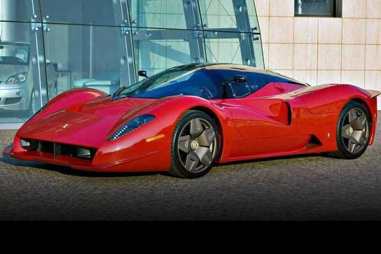 A red sports car with a sleek, aerodynamic design—one of the 1-of-1: Rarest Ferraris In The World—is parked on a paved surface in front of a modern glass building.