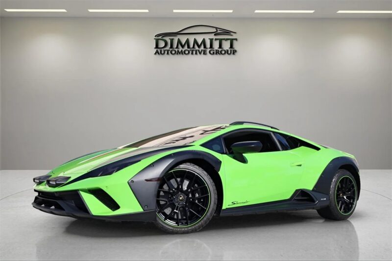A bright green Lamborghini exotic car is displayed in a showroom with a "Dimmitt Automotive Group" sign on the wall behind it.