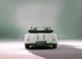 A rear view of the vintage-style Morgan Plus Four with the license plate reading "PLUS FOUR" is set against a softly lit, neutral background—an elegant nod to the 75th Anniversary of this iconic car.