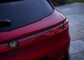 Close-up of the rear end of a red Alfa Romeo Tonale, highlighting the taillight design, rear badge, and part of the rear window—now featuring sharper handling with the 2026 update.