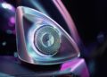 Close-up of a metallic car speaker with LED lighting in a modern Mercedes Maybach interior, illuminated by purple and blue ambient lights—creating the vibe of a rolling music studio.