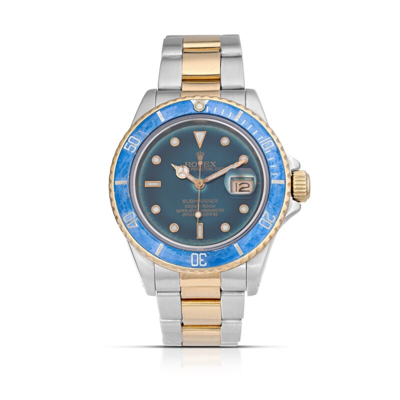 A two-tone Rolex Submariner watch with a blue bezel, blue dial, gold accents, and a date display—one of the best luxury watches—photographed on a white background.