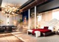 Luxurious modern bedroom at Aureum Estate with a unique geometric headboard, red bedding, stylish seating area, large windows, dramatic lighting, and indoor plants—an ambiance as exquisite as a Jacob & Co masterpiece.