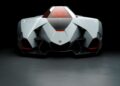 Futuristic silver concept car with sharp angles, red interior, and a Lamborghini emblem, photographed from the front against a dark background—a stunning tribute to Lamborghini Centro Stile at 20: The Studio Behind Every Modern Bull.