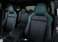 Interior view of a luxury Aston Martin showcasing black and green leather seats with the Aston Martin logo, alongside a digital customization menu from the online configurator on the right side of the image.