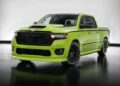 A bright green, modern pickup truck with black wheels and accents—showcasing Mopar Performance Concepts—is parked indoors on a reflective floor with a neutral background.