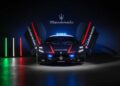 A Maserati MCPURA police car with upward-opening doors is displayed under the Maserati logo, with Italian flag lights on the floor—highlighting how vehicles like the Alfa Giulia Quadrifoglio join Italy’s high-speed medical fleet.