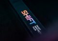 A rectangular box labeled "SHIFT Paint Protection Film" with a colorful logo, set against a dark background, highlights premium vehicle protection and pairs perfectly with Ceramic Pro treatments.