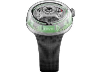 A modern wristwatch with a transparent case, visible mechanical components, green fluid time display, and a black textured strap—an innovative design that stands out among the best luxury watches.