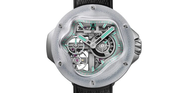 A modern wristwatch inspired by the Hublot MP-17, featuring a transparent, asymmetrical face revealing internal gears, a black textured strap, and mint green accents on the dial and hour markers—a striking limited edition piece.