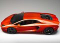 A bright orange Lamborghini Centro Stile at 20 sports car with black wheels, shown from a high side angle against a neutral background—celebrating the studio behind every modern bull.