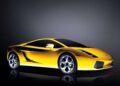 A yellow sports car is parked in a studio setting, its sleek form echoing the innovative spirit of Lamborghini Centro Stile at 20: The Studio Behind Every Modern Bull, with dark gradient lighting and dramatic reflections on the ground.