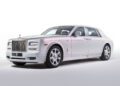 A silver bespoke Rolls-Royce Phantom luxury sedan is parked on a white background, angled to show the front and side.