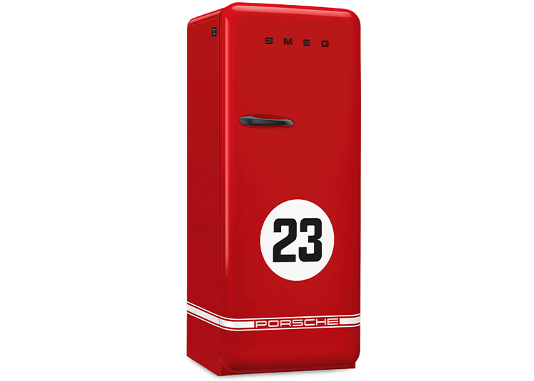 Red SMEG refrigerator from the kitchen collection, featuring "23" and "Porsche" on the front in a retro style with white racing stripes, standing upright against a plain background.