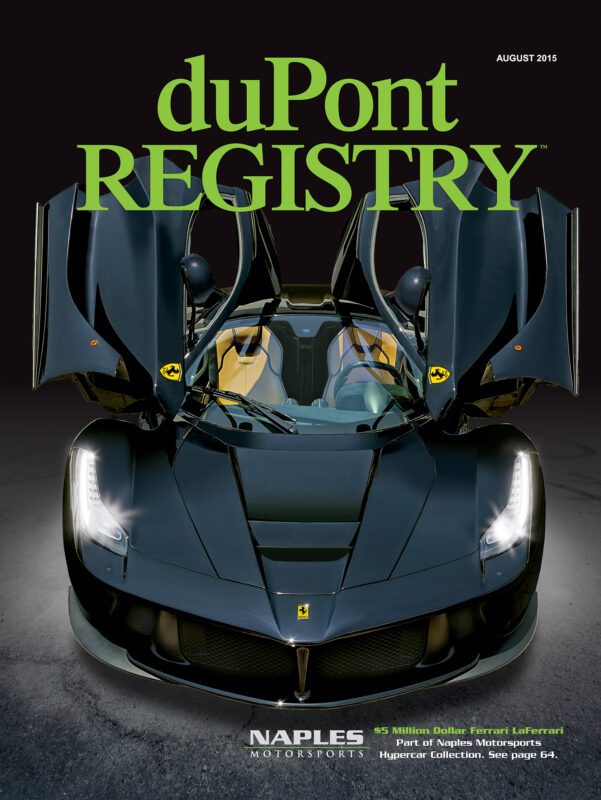 Front view of a black Ferrari LaFerrari with butterfly doors open, featured as one of the Cover Cars on the August 2015 duPont REGISTRY magazine for its 40th Anniversary.