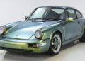A Porsche Classic 911 sports car with an iridescent green and gold finish, photographed in a white studio setting—an inspiring entry for the 2025 Restoration Challenge.