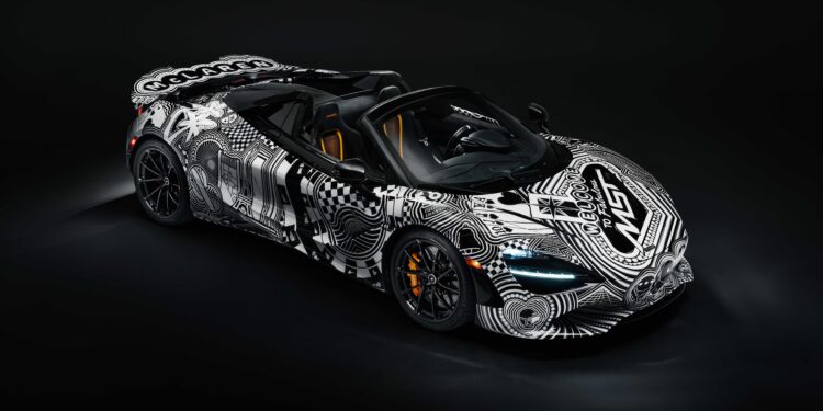 A black sports car with white geometric and graphic patterns, inspired by Project Viva Revealed: One-of-One McLaren 750S Spider Brings Las Vegas to Life, is parked in a dark studio setting.