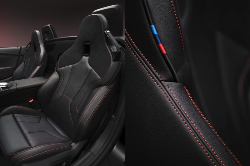 Black leather car seats with red stitching, featuring a close-up of the seat's detailing and a small strip of red, blue, and light blue stitching on the side—exclusive to the End of the Road: 2026 BMW Z4 Final Edition Breaks Cover.