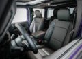 Interior view of a modern car with black leather seats, center console, and dashboard controls visible—reminiscent of the refined styling found in Jeep’s 85th Anniversary Limited Edition Moab 392.