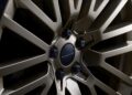 Close-up of a bronze-colored Land Rover alloy wheel with detailed spokes and visible lug nuts, featured on the new Range Rover Expands 2026 Sport Lineup with SV Black, SV Carbon, and SV Bespoke Editions.