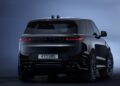 Rear view of a black Range Rover SUV with tinted windows, illuminated tail lights, and license plate 473 UBG against a blue gradient background, inspired by the Range Rover Expands 2026 Sport Lineup with SV Black and SV Bespoke Editions.