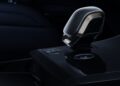 Close-up of a modern automatic car gear shift lever in a dark, high-gloss interior, inspired by Range Rover’s 2026 Sport lineup expansion with SV Black, SV Carbon, and SV Bespoke Editions.