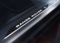 Illuminated "Range Rover" logo with an electric vehicle symbol on a sleek black interior door sill, celebrating the Range Rover Expands 2026 Sport Lineup with SV Black, SV Carbon, and SV Bespoke Editions.