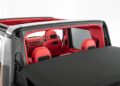 A vehicle with a retractable roof is shown from above, featuring a red and black interior with visible seats and dashboard as Brabus debuts the 800 Cabrio.