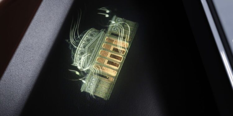 A holographic projection of a classical building with columns shines on a dark surface, illuminated by green and orange light—reminiscent of Mulliner’s bespoke Bentley Welcome Lamps design.