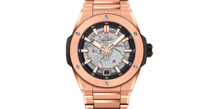 A rose gold Hublot wristwatch with a metallic bracelet, exposed movement on the dial, black accents, and a date window at 6 o'clock—an exquisite choice among the best luxury watches.