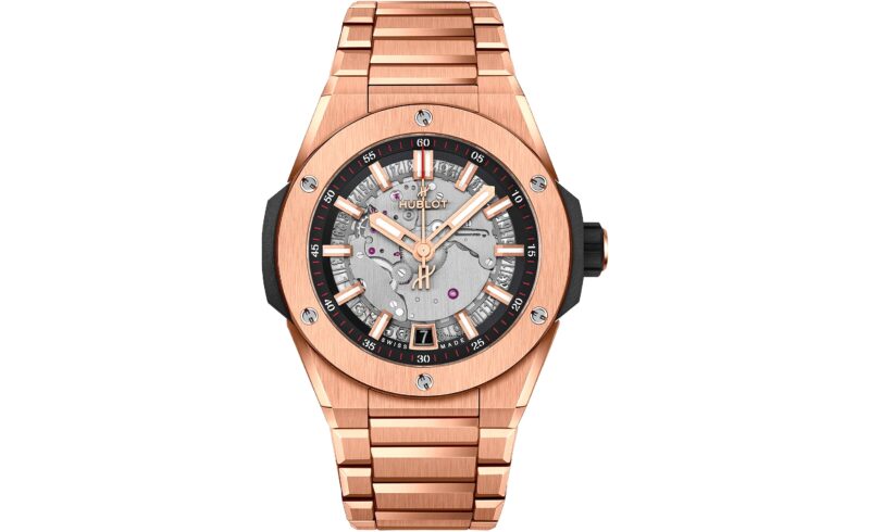 A rose gold Hublot wristwatch with a metallic bracelet, exposed movement on the dial, black accents, and a date window at 6 o'clock—an exquisite choice among the best luxury watches.