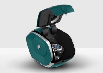 A luxury Audemars Piguet wristwatch is displayed inside a modern, teal and black AI Setting Box with the AP logo, shown open against a plain background.