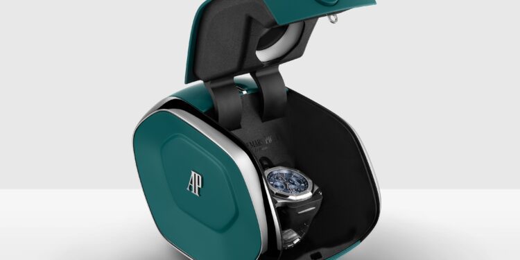 A luxury Audemars Piguet wristwatch is displayed inside a modern, teal and black AI Setting Box with the AP logo, shown open against a plain background.