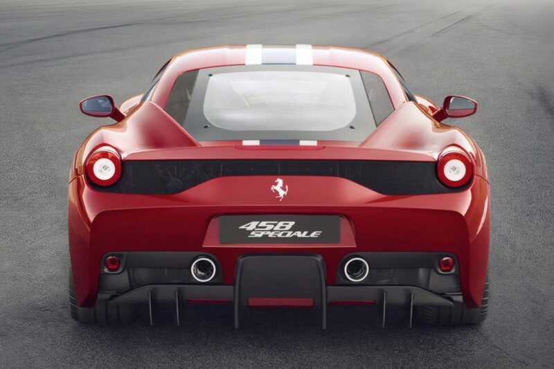 Rear view of a red Ferrari 458 Speciale parked on asphalt, showcasing its tail lights, rear grille, exhaust pipes, and distinctive racing stripes—the last naturally aspirated mid-engine V8 Ferrari ever built.