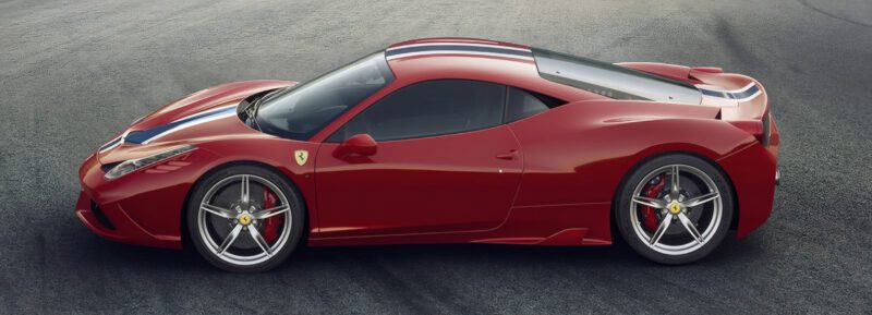 Side view of a red Ferrari sports car—The Last Naturally Aspirated Mid-Engine V8 Ferrari Ever Built—with silver wheels and a white and blue racing stripe, parked on a paved surface.