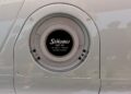 Close-up of a metallic vehicle charging or fueling port labeled "Stäubli SAF 45," shown at Feature Exclusive: 2025 Icons of Porsche Dubai, with a patent number and notice of other countries.