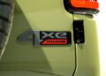Close-up of a "4xe MOAB" badge on the rear of a light green 2026 Jeep Recon, highlighting its trail-ready Jeep design, with part of a taillight and tire visible.