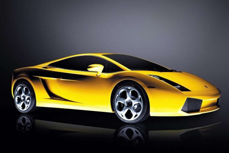 A yellow sports car with a sleek, aerodynamic design is shown against a dark background—The Last Lamborghini With Rear Wheel Drive and a Manual Transmission.