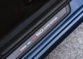 Close-up of a BMW M340i door sill plate with the text "3 Series 50 Jahre Edition" and a small colored stripe, marking this xDrive model as a special anniversary edition.