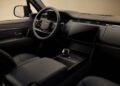 The image shows the interior of a modern Range Rover SV Black, featuring a black leather steering wheel, digital dashboard, large touchscreen display, and minimalist console design with signature SV Luxury Features.