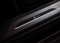 Close-up of a Range Rover door sill plate with a metallic finish, featuring a "BLACK" label and car seat icon, highlighting SV Luxury Features.