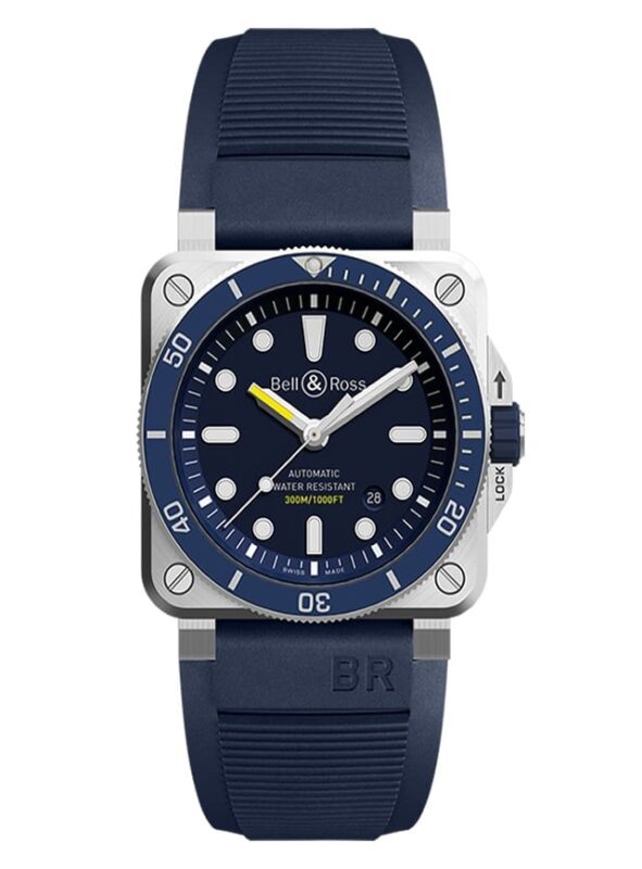 A Bell & Ross automatic wristwatch, ranked among the best luxury watches, with a square stainless steel case, blue rotating bezel, blue rubber strap, and water resistance up to 300m.
