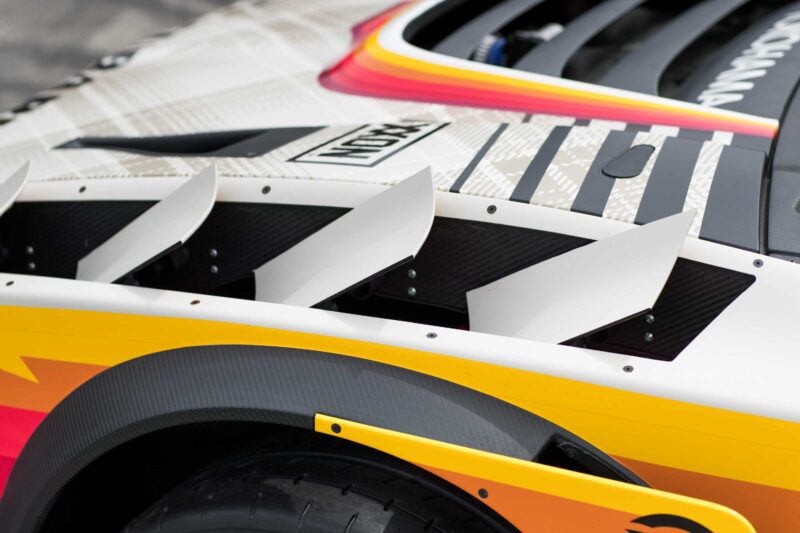Close-up of the Subaru Brataroo’s rear fender at SEMA 2025, showcasing aerodynamic vents, vibrant graphics, and a Turbo badge above the visible tire.