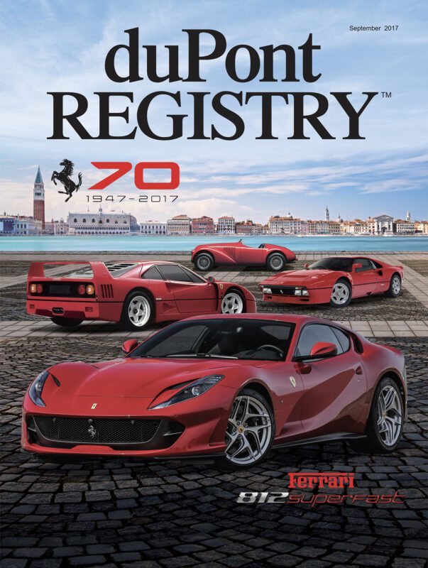 Cover Cars headline on the duPont REGISTRY magazine shows three red Ferrari models on a stone plaza with a cityscape backdrop, celebrating Ferrari's 70th anniversary (1947-2017) and duPont REGISTRY's upcoming 40th Anniversary.
