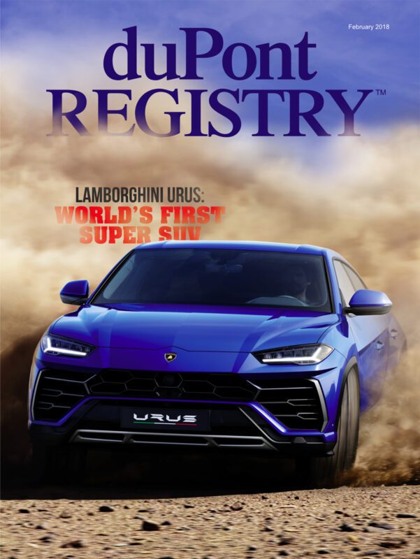 A blue Lamborghini Urus drives through dust on the duPont REGISTRY Cover Cars issue for February 2018, with the headline "World's First Super SUV.