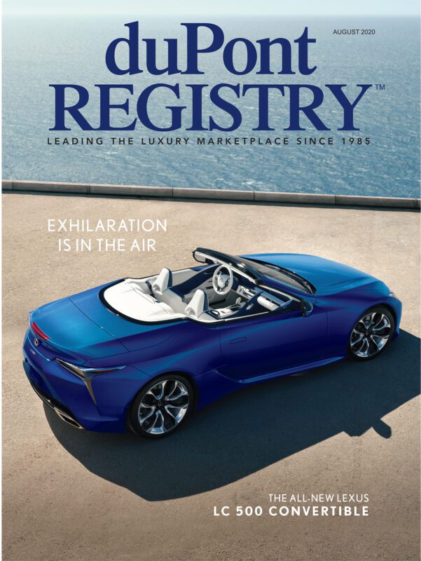 Cover Cars take center stage on the duPont REGISTRY 40th Anniversary issue, featuring a blue Lexus LC 500 convertible parked by a sunlit coastal road, with the headline "Exhilaration Is In The Air.