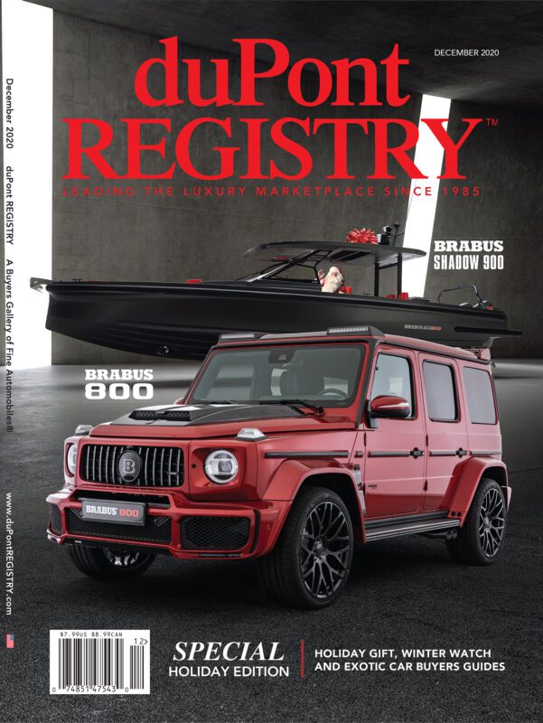 A red Brabus 800 SUV is parked in front of a black Brabus Shadow 900 boat inside a modern garage; duPont REGISTRY 40th Anniversary Cover Cars, December 2020.