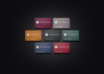 Seven Porsche credit cards, each displaying the Porsche logo, are arranged on a black background in vibrant shades of yellow, red, green, blue, and gray.