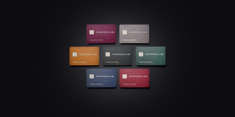 Seven Porsche credit cards, each displaying the Porsche logo, are arranged on a black background in vibrant shades of yellow, red, green, blue, and gray.